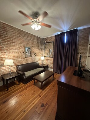 Suite, 1 King Bed with Sofa bed, Non Smoking | Premium bedding, pillow-top beds, individually decorated, desk - Inn on St. Peter (New Orleans)