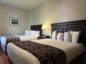 Deluxe Room, 2 Queen Beds | Premium bedding, pillow-top beds, individually decorated, desk - Inn on St. Peter (New Orleans)