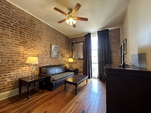 Suite, 1 King Bed with Sofa bed, Non Smoking | Living area | Flat-screen TV, MP3 dock