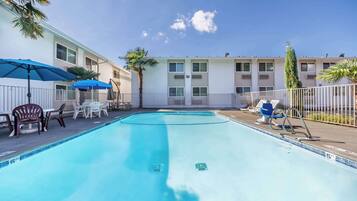 Seasonal outdoor pool, open 9:00 AM to 9:00 PM, pool umbrellas