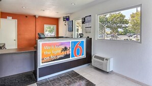 A hotel reception area with a large sign advertising the number 6. - Motel 6 Campbell, CA - San Jose (Campbell)