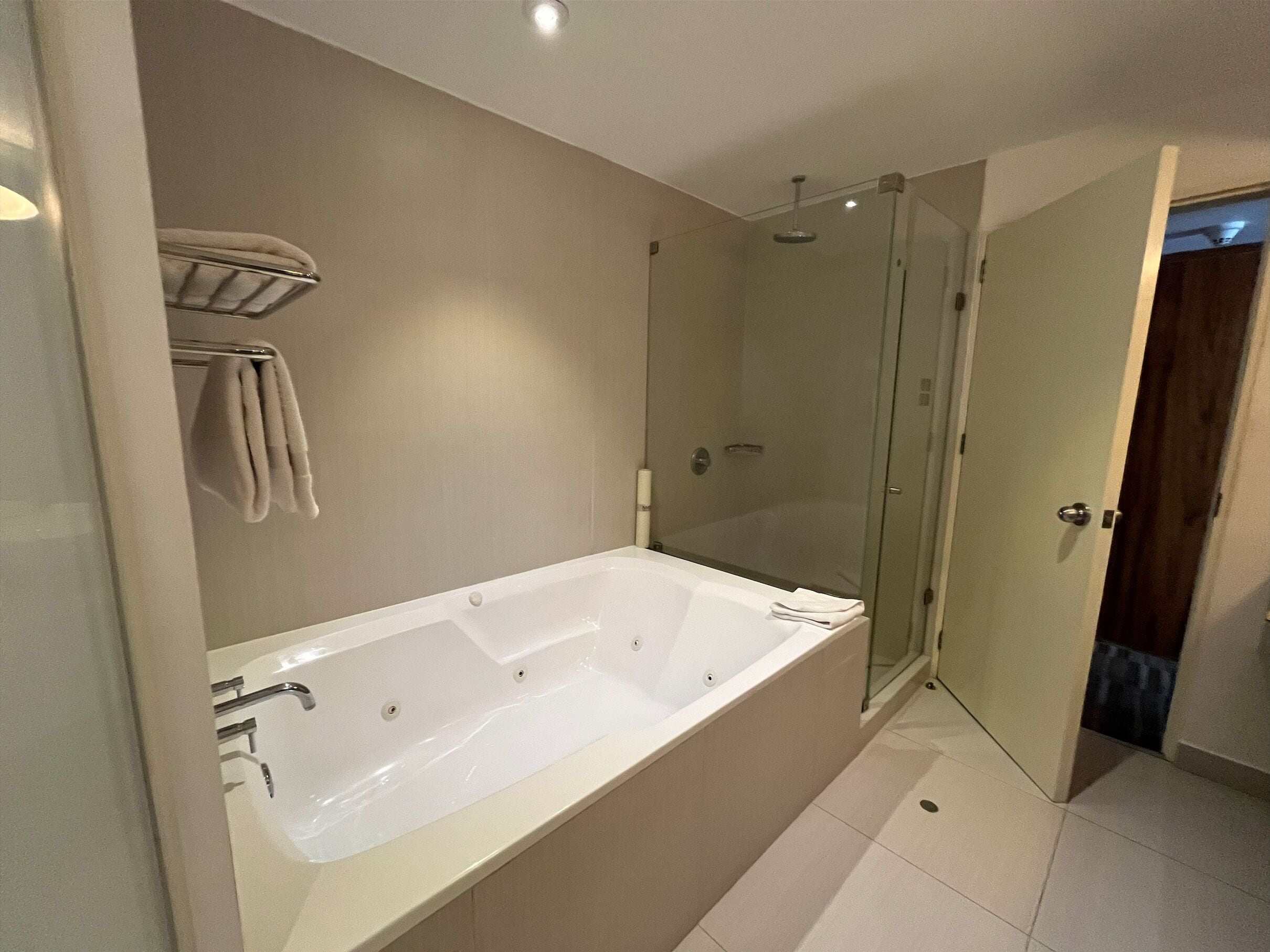 junior suite, 1 king bed | bathroom | combined shower/bathtub, rainfall showerhead, free toiletries