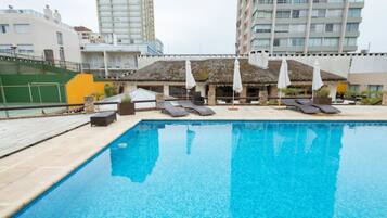Indoor pool, outdoor pool, open 8:00 AM to 10 PM, pool umbrellas