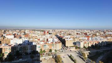 A cityscape with a prominent building labeled "RIVADORA" in the center.