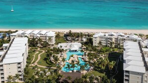A resort with a swimming pool, beach, and ocean view. - Alexandra Resort - All-Inclusive (Providenciales)