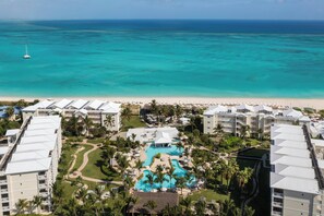 On the beach, white sand, sun loungers, beach umbrellas