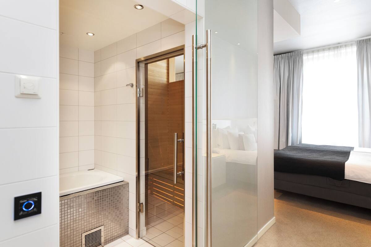 suite | bathroom | shower, rainfall showerhead, eco-friendly toiletries, hair dryer