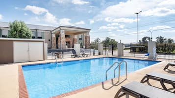 Seasonal outdoor pool, open 8:30 AM to 8:30 PM, pool loungers