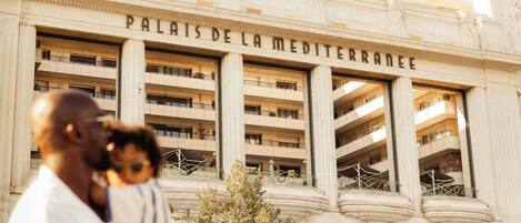 A building with the inscription 'PALAISES DE LA MEDITERRANEE' indicating a hotel or resort.