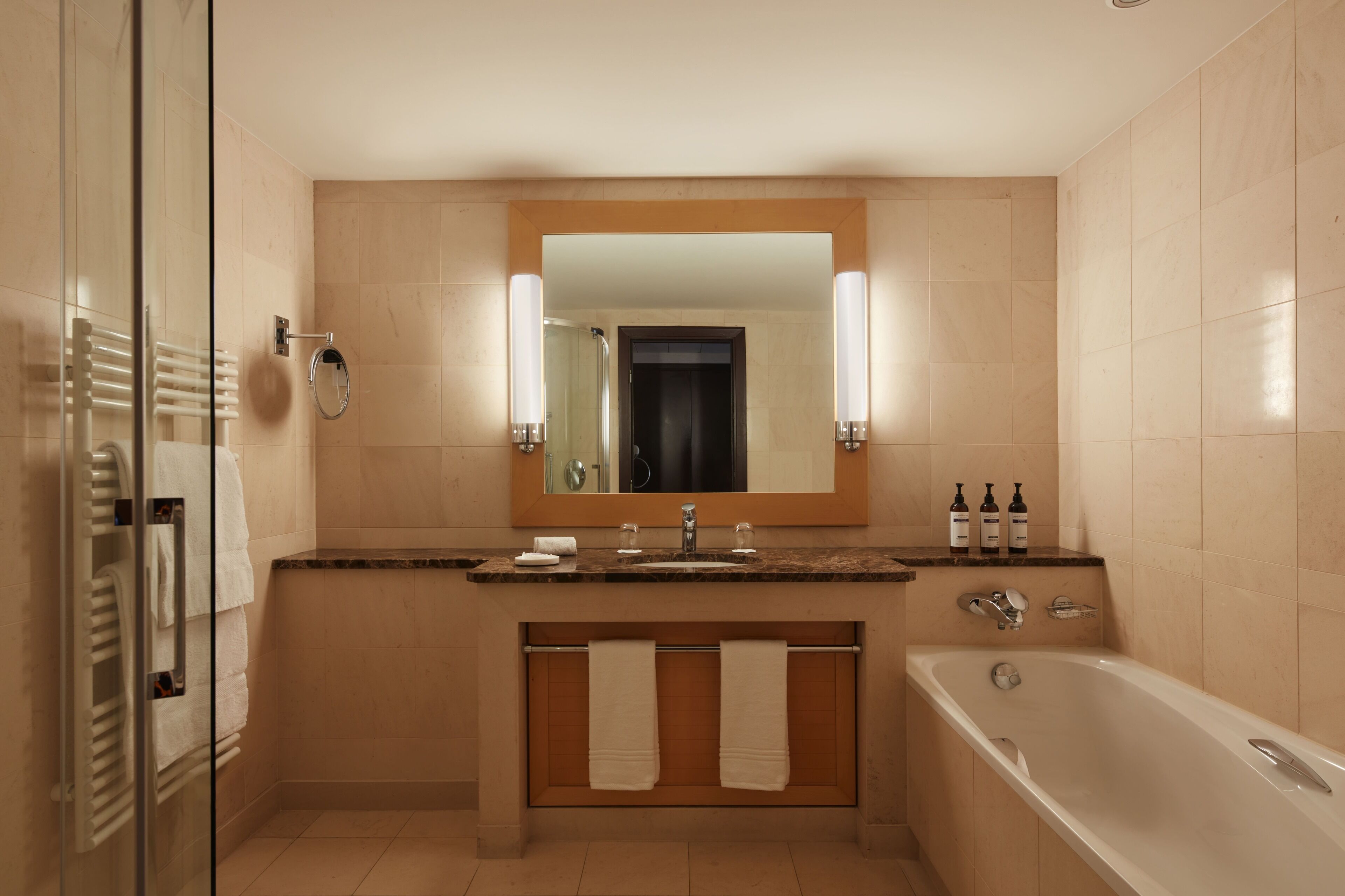 deluxe room, 2 queen beds | bathroom | designer toiletries, hair dryer, bathrobes, slippers