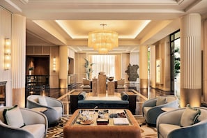 A spacious lobby with a grand chandelier, a reception desk, and comfortable seating areas. - Hôtel Palais de la Méditerranée In The Unbound Collection By Hyatt (Nice)