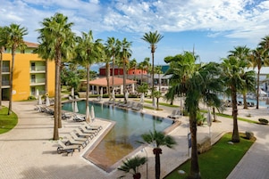 3 outdoor pools, open 10:00 AM to 6:00 PM, pool umbrellas, pool loungers