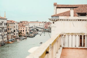 A canal with buildings and a bridge, suggesting a historic city setting.