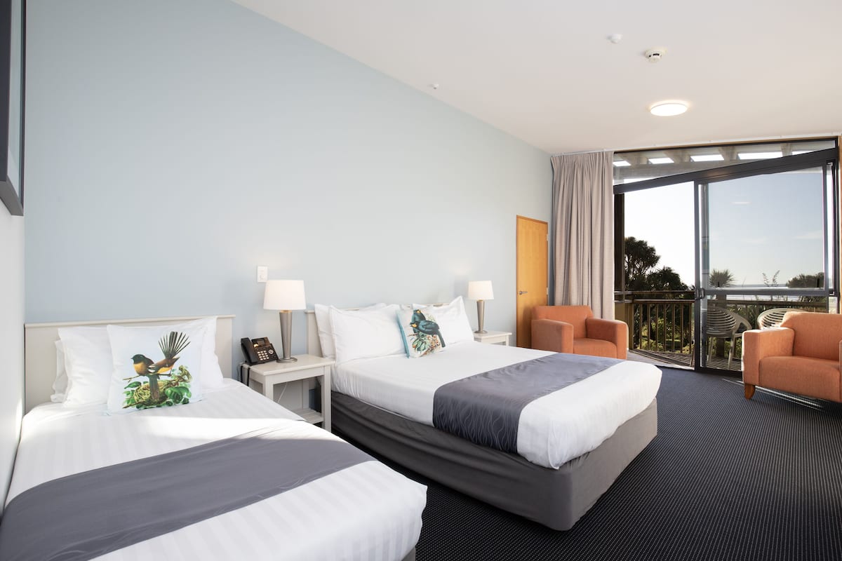 rainforest room - balcony | 1 bedroom, desk, laptop workspace, iron/ironing board