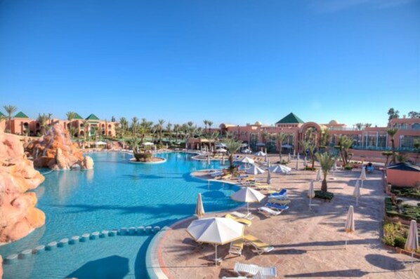 Indoor pool, outdoor pool, pool umbrellas, pool loungers