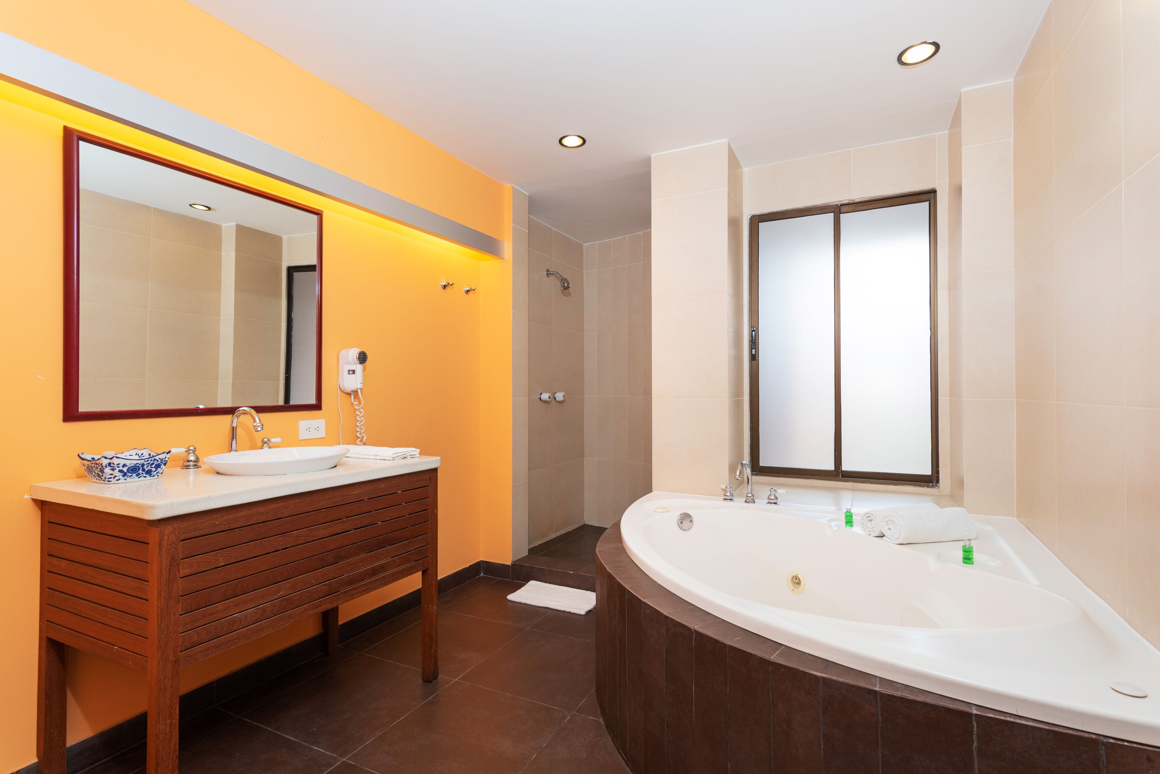 deluxe room, bathtub | bathroom | free toiletries, hair dryer, towels, soap