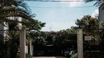 A gated entrance to a property labeled "Cottage."