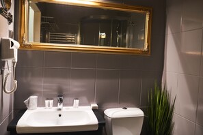 Designer toiletries, hair dryer, towels, soap