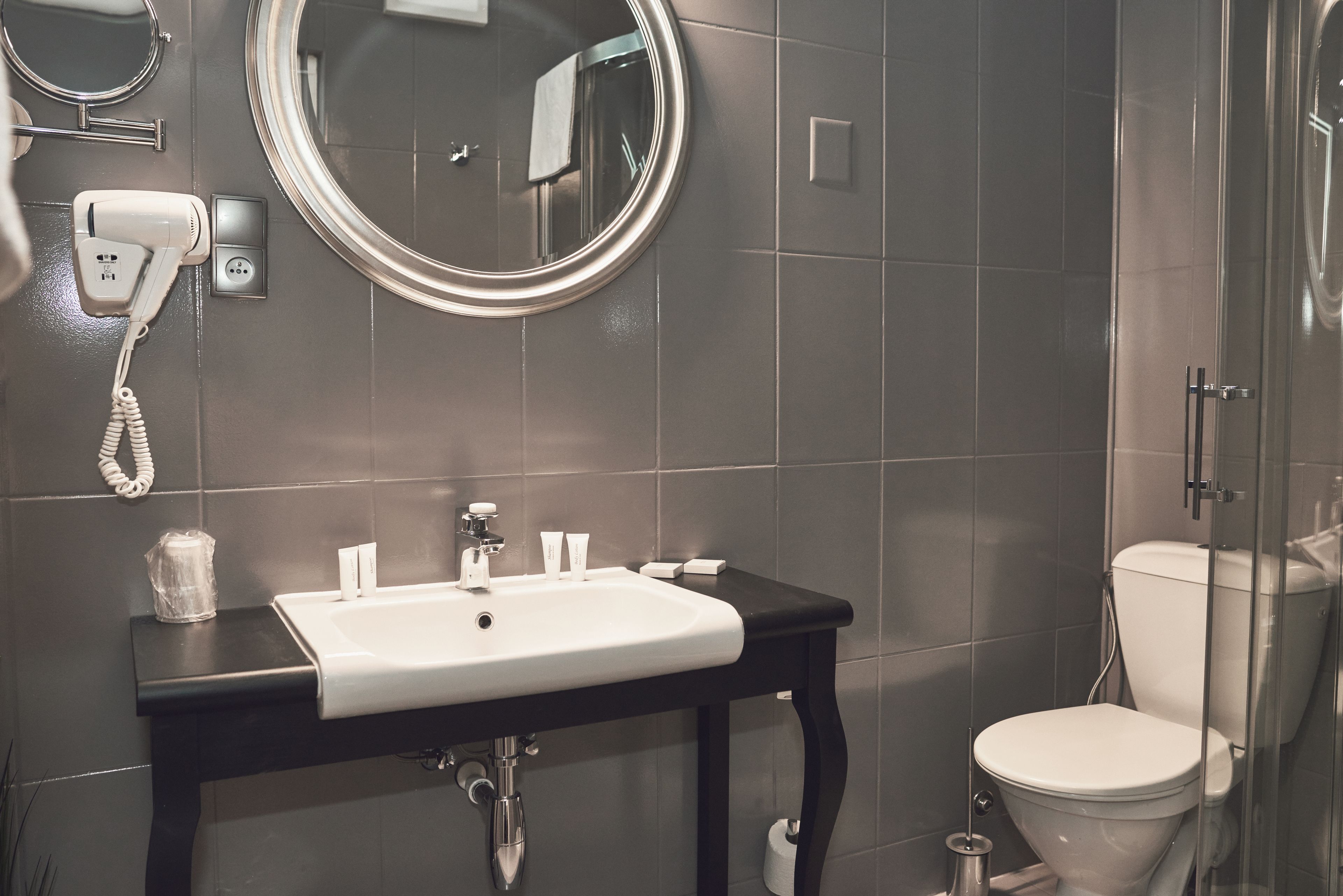 designer toiletries, hair dryer, towels, soap