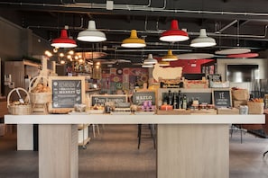 A bakery counter with various baked goods and a chalkboard menu. - ibis Madrid Fuenlabrada (Fuenlabrada)
