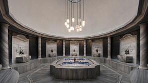 A luxurious, circular marble lobby with a central fountain, elegant lighting, and marble columns. - Barut Hemera - Ultra All Inclusive (Manavgat)