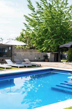 Seasonal outdoor pool, pool umbrellas, pool loungers