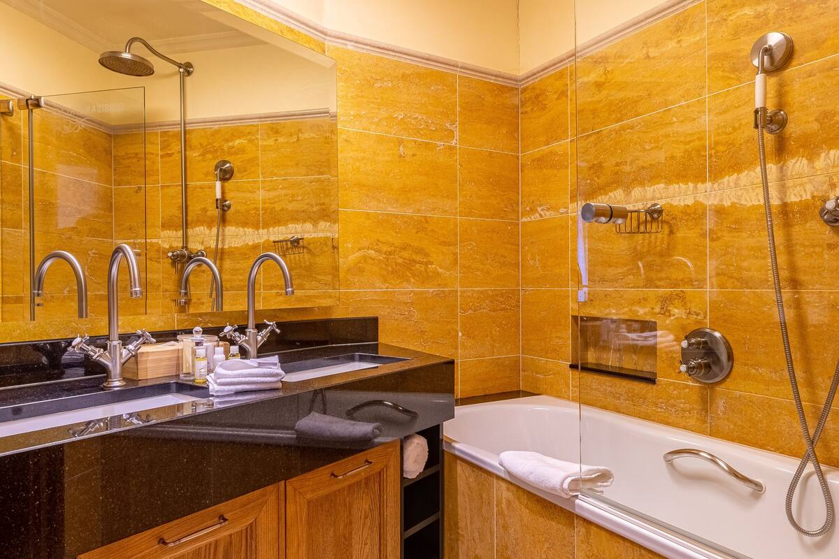 depandance pupp quisisana double room (wellness access) | bathroom | free toiletries, hair dryer, bathrobes, towels