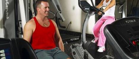 A gym with treadmills and exercise equipment.