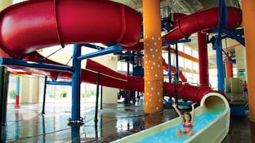 A water park with multiple slides and a pool area.