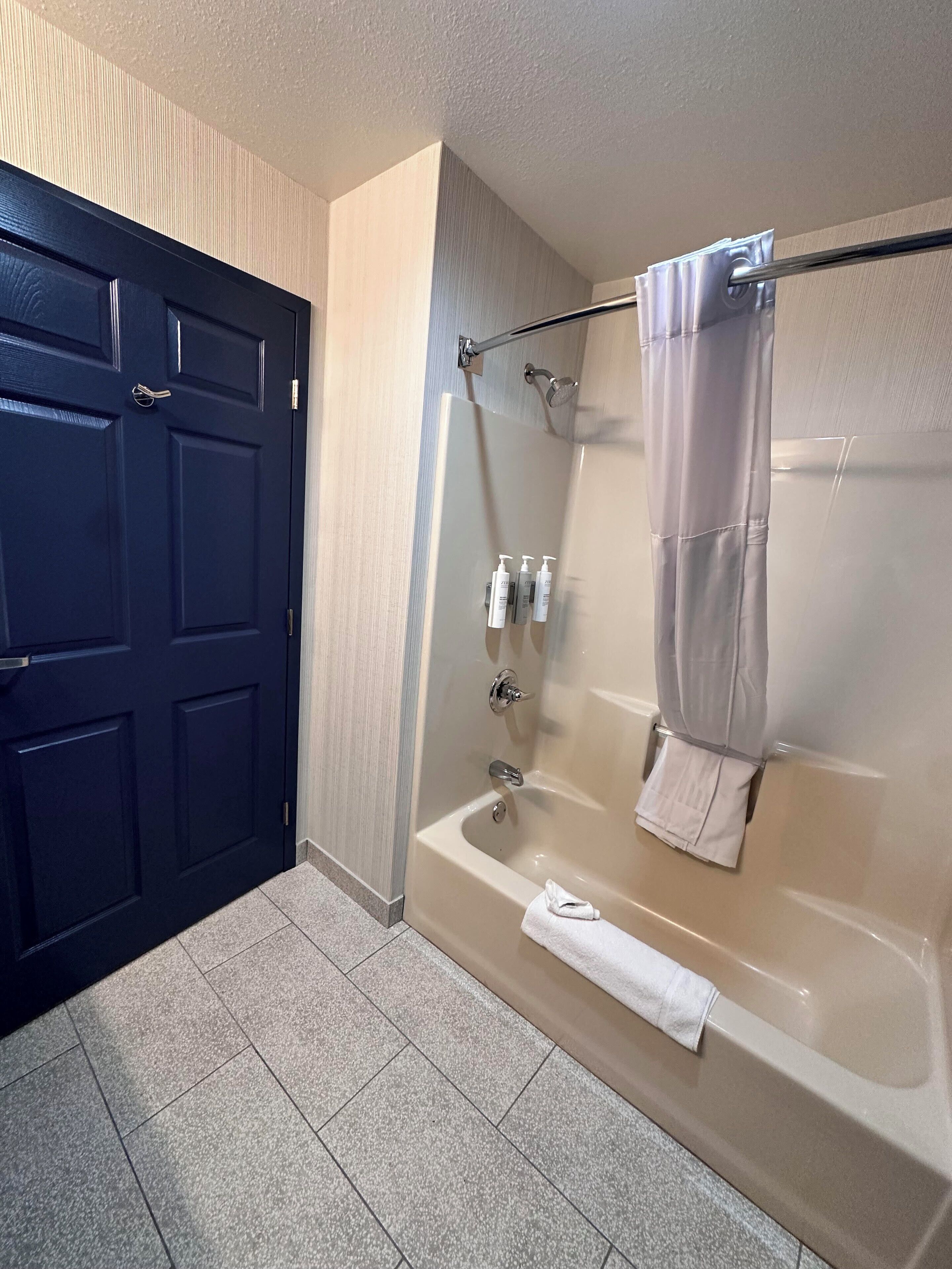 combined shower/bathtub, hair dryer, towels, soap