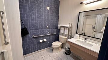 Room, 1 King Bed, Accessible (Mobility, Roll-In Shower) | Bathroom | Combined shower/tub, hair dryer, towels, soap