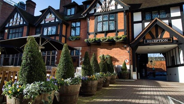 A traditional building with a reception area and multiple windows. - The White Hart Hotel (Kingston Upon Thames)