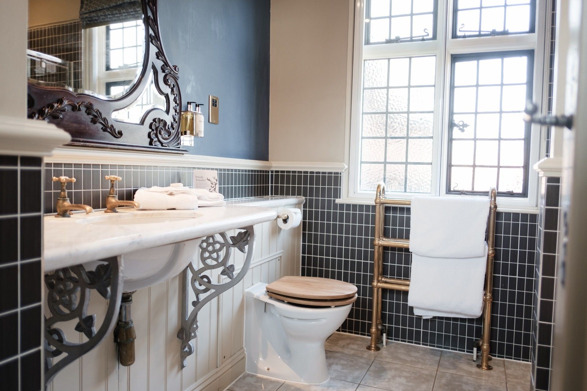 deluxe king room | bathroom | shower, rainfall showerhead, free toiletries, hair dryer