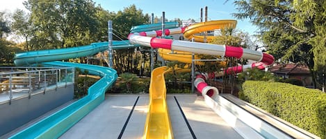 A water park with multiple water slides in various colors.