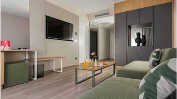 Suite, Balcony | Minibar, in-room safe, desk, blackout drapes