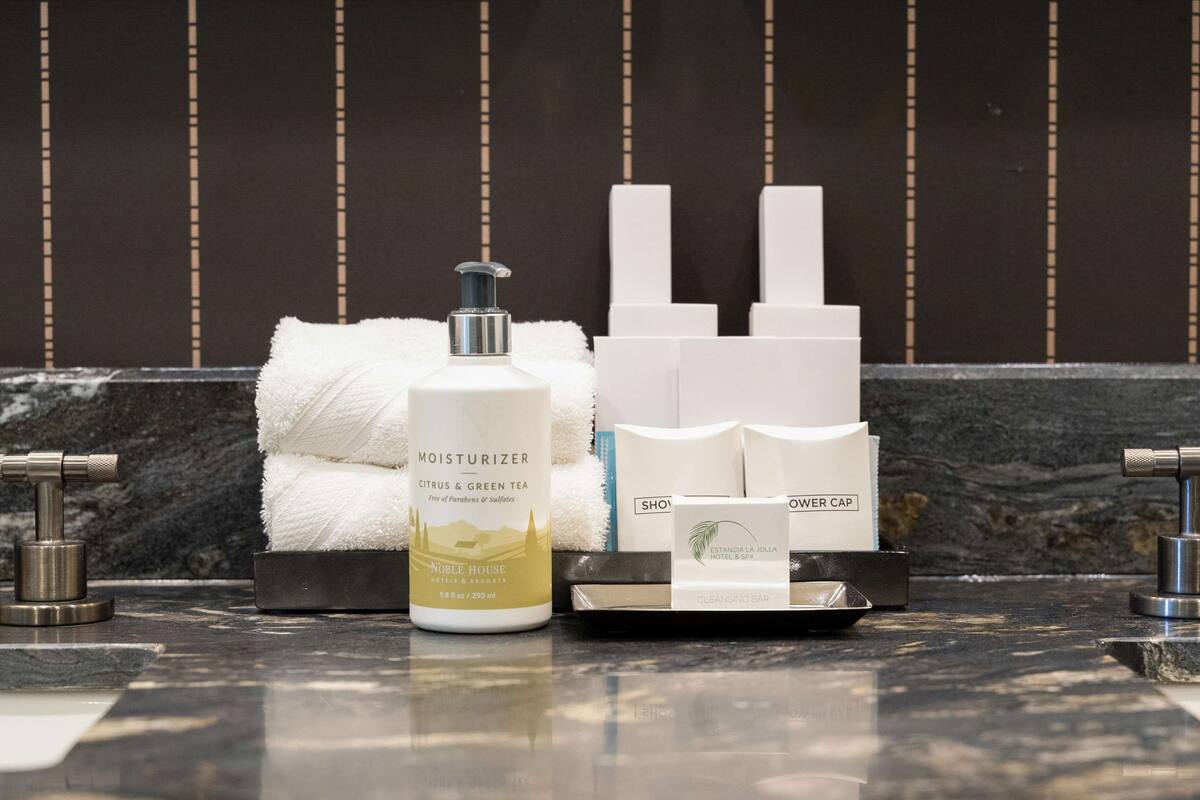 combined shower/bathtub, designer toiletries, hair dryer, bathrobes