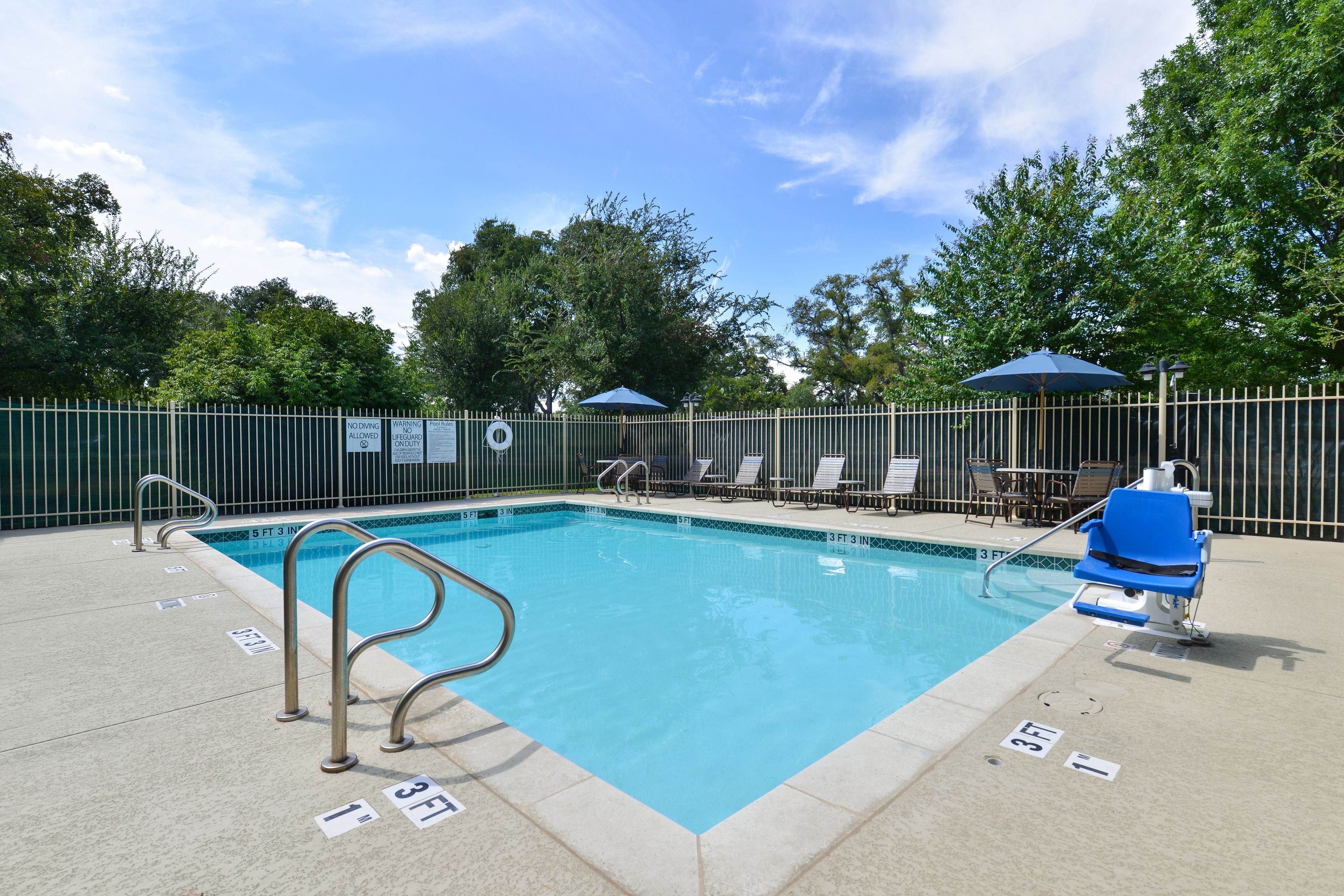 seasonal outdoor pool, pool umbrellas, pool loungers