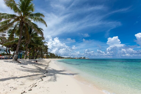 Beach nearby, white sand, beach towels