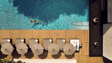 Outdoor pool, open 7 AM to 8 PM, pool umbrellas, sun loungers