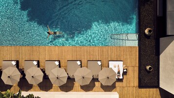 Outdoor pool, open 7 AM to 8 PM, pool umbrellas, sun loungers