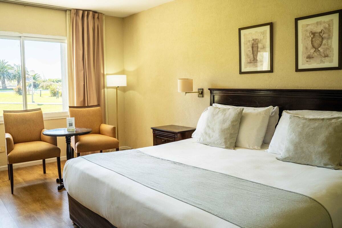 Hypo-allergenic bedding available, down comforters, minibar