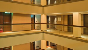 A multi-level interior with glass railings and a modern design. - Les Suites Taipei Ching Cheng (Taipei)