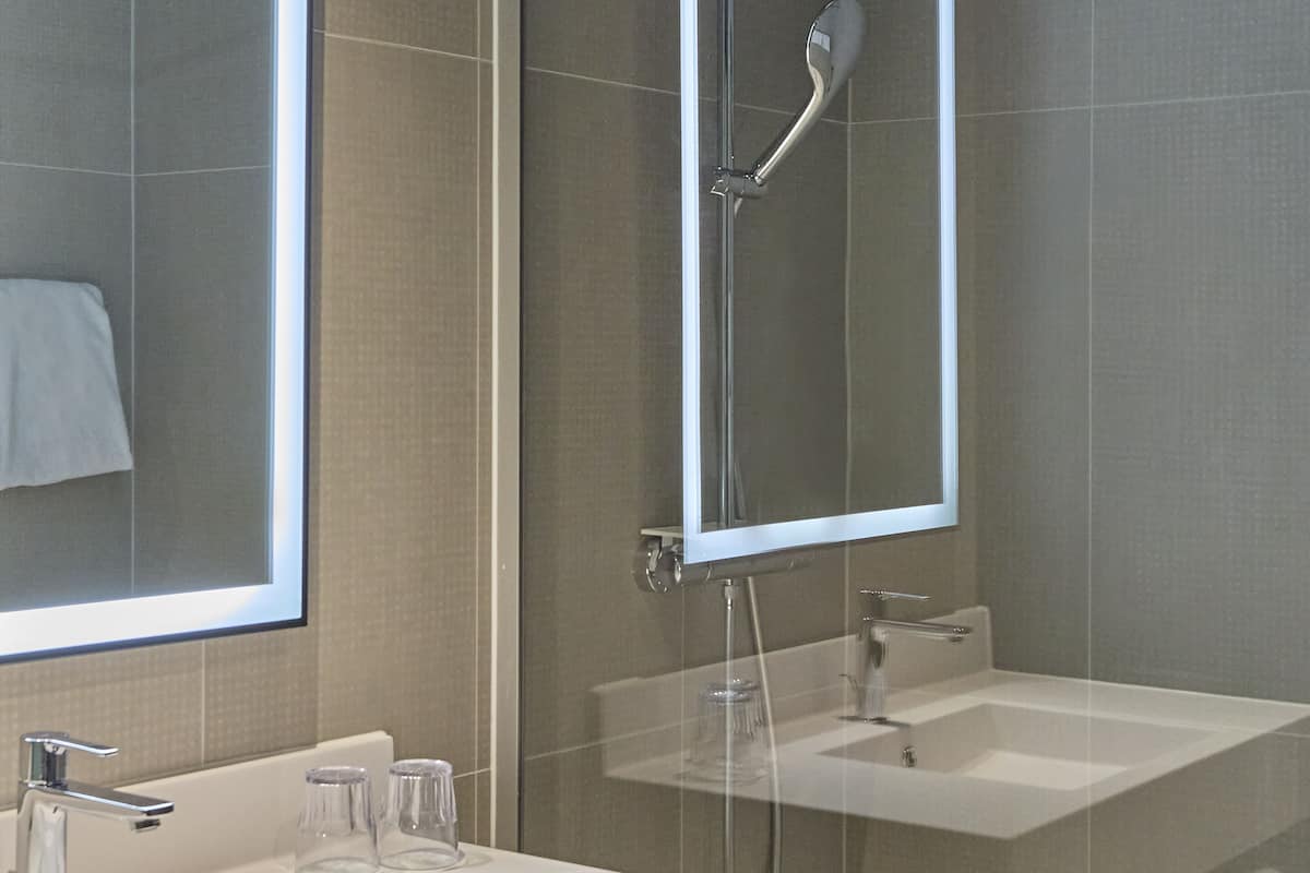 superior room, 1 queen bed with sofa bed | bathroom | separate bathtub and shower, eco-friendly toiletries, hair dryer, towels