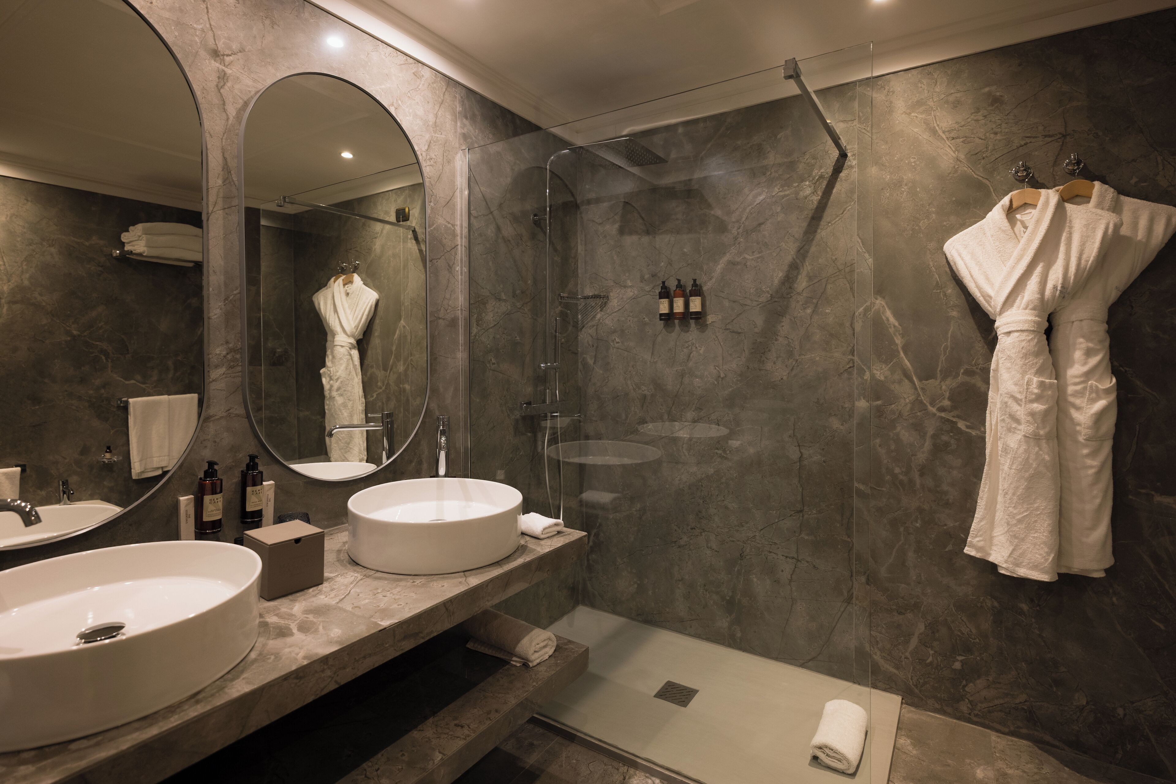 designer toiletries, hair dryer, bathrobes, slippers