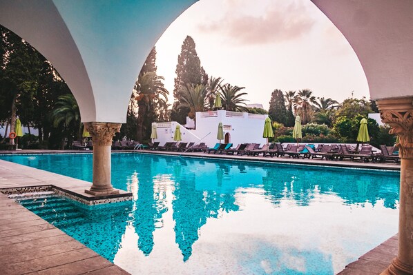 Indoor pool, outdoor pool, pool umbrellas, pool loungers