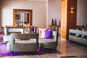 3 bars/lounges, poolside bar, beach bar