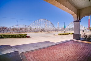 A roller coaster under construction with a clear sky.