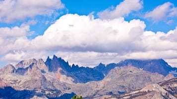 A mountainous landscape with rugged peaks and a clear sky.
