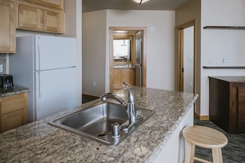 Condo, 2 Bedrooms (Two Bedroom Condominium with 2 Kings) | Private kitchen | Fridge, microwave, oven, stovetop at Juniper Springs Resort