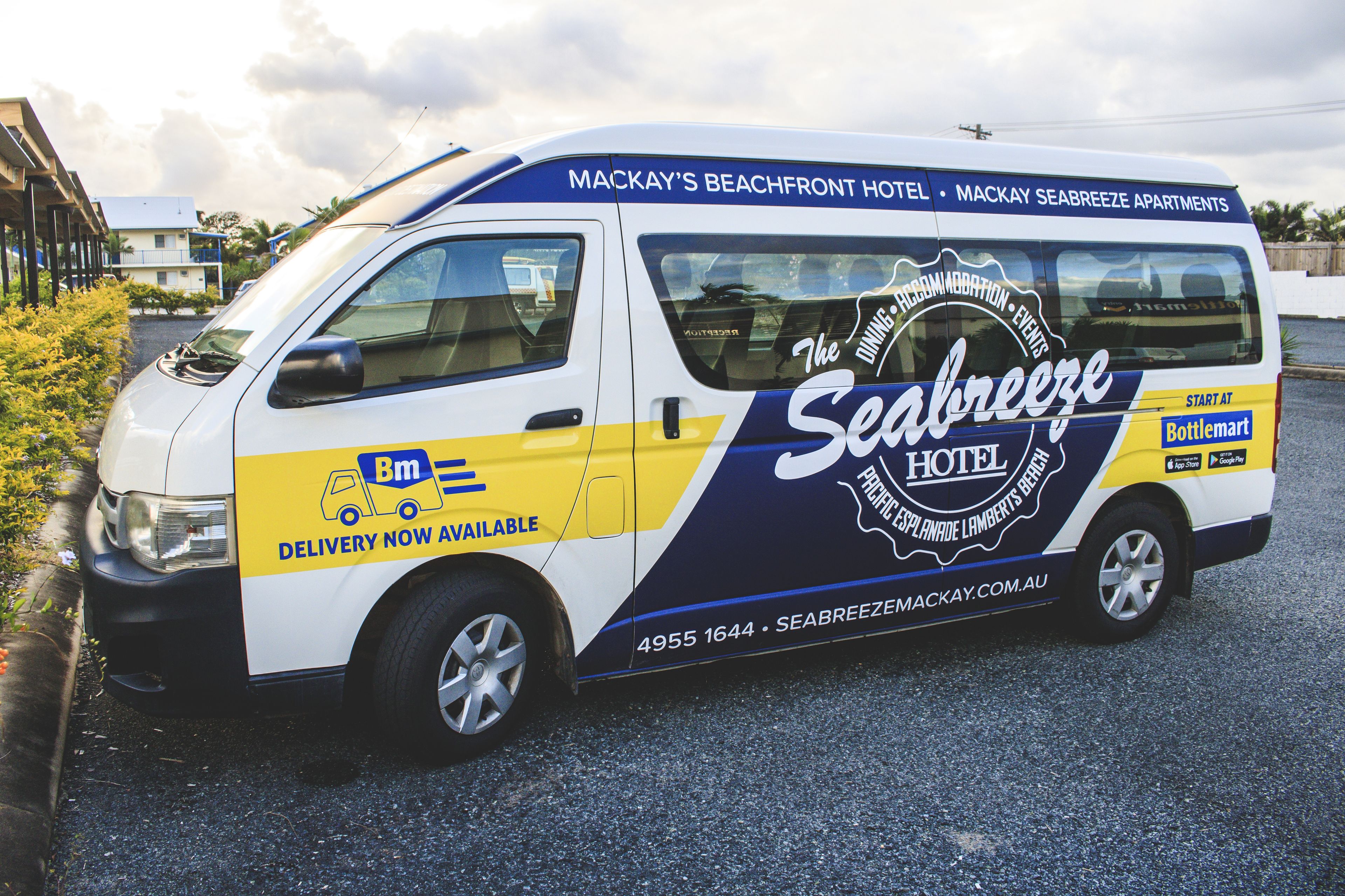 A delivery van with "The Seabreeze Hotel" branding, indicating a partnership or service related to the hotel.
